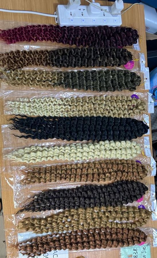 Italian curl extensions laid out in a range of colours