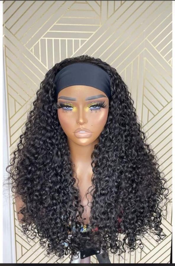 Long black curly headband wig on a mannequin